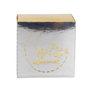 Detailed silver and gold Mubarak gift box with intricate moon and mosque cutout patterns