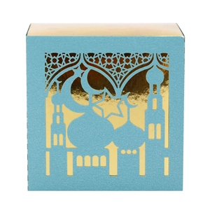 Detail of blue laser-cut candy box with moon and mosque pattern for Eid party