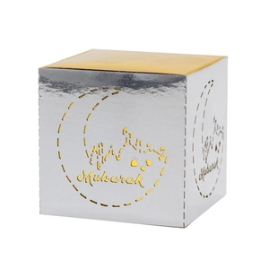 Detail of square Eid Mubarak candy box featuring gold lid and silver cutout mosque design