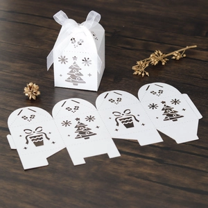 Detailed laser-cut Christmas tree candy box in white with snowflake hollow design