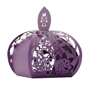 Detail of purple laser-cut flower patterns on a gift box with elegant leaf handle