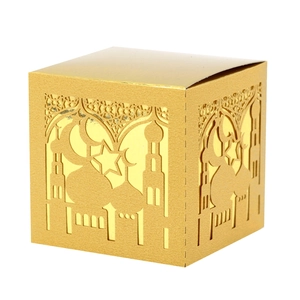 Detail of gold hollow-out gift box with laser cut mosque, moon and star patterns