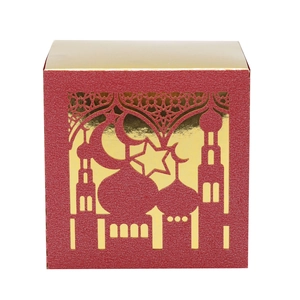 Detailed close-up of hollowed-out star and moon pattern on red festive candy box