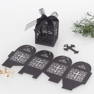 Detail of laser-cut black cross candy box with ribbon and unfolded template view