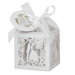 Laser cut wedding favor box with white ribbon and Thank You tag in macro detail