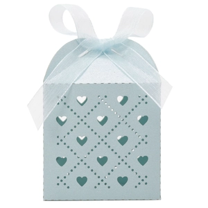Close-up of light blue laser-cut heart favor box with a white organza ribbon bow