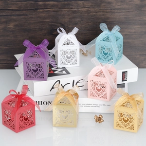Colorful laser-cut heart candy boxes with matching ribbons for weddings and parties