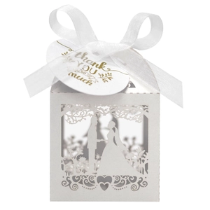 Laser cut white wedding favor box with ribbon and thank you tag featuring couple silhouette