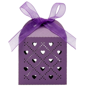 Detail of purple favor box with laser-cut heart patterns and a satin ribbon bow