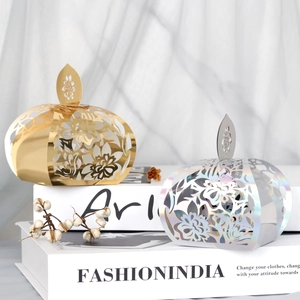 Exquisite laser-cut pumpkin favor boxes in gold and iridescent silver for wedding gifts