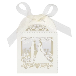 Detailed laser-cut wedding candy box with heart motifs and elegant satin ribbon bow