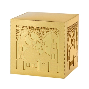 Macro detail of laser-cut mosque and moon patterns on a matte gold gift candy box