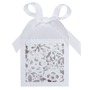 Laser cut white paper gift box with floral pattern and ribbon bow for wedding favors