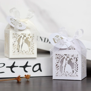 Laser cut wedding favor box in white with ribbon and thank you tag for candy gifts