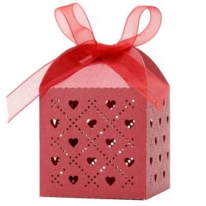 Red laser-cut heart favor box with sheer ribbon bow for weddings and parties