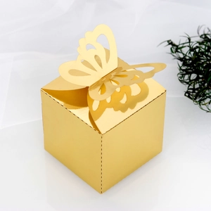 Close-up of mirror gold gift box featuring an elegant hollow butterfly cutout lid design