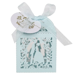 Light blue laser-cut wedding favor box with romantic silhouette and thank you tag