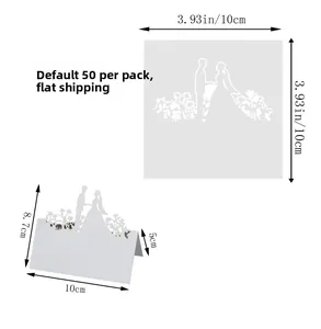 Detailed view of white laser-cut wedding place cards with bride and groom silhouette