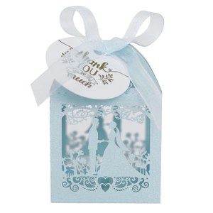 Close-up of laser-cut light blue wedding favor box with ribbon and Thank You tag