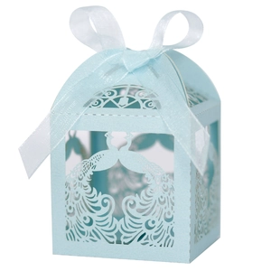 Light blue laser cut peacock candy box with white ribbon bow for wedding gifts