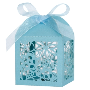 Laser-cut light blue wedding favor box with floral patterns and matching ribbon bow