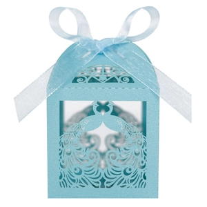 Detailed laser-cut blue peacock candy box with elegant silk ribbon bow for weddings