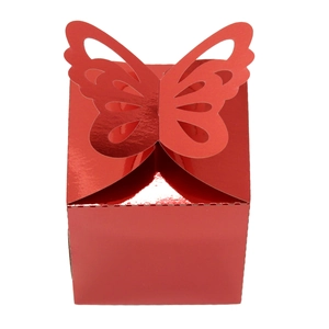 Detail of red metallic candy box featuring a butterfly shaped folding top closure