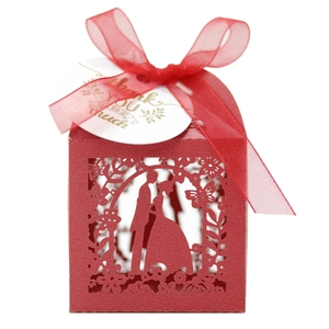 Detailed laser-cut wedding candy box with red ribbon and thank you gift tag