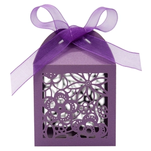 Detail showing laser-cut floral pattern and organza ribbon on purple wedding favor gift box