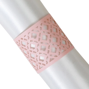 Pink laser-cut paper napkin rings with geometric hollow pattern for party table decor