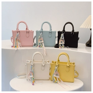Chic handbags in multiple colors featuring rainbow charms and Love Is Eternal straps