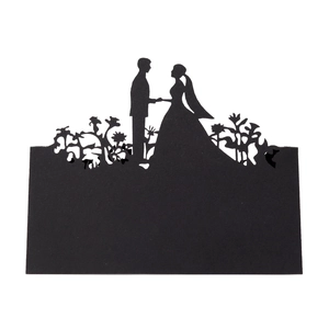 Detailed laser-cut black wedding silhouette card with elegant couple and floral patterns
