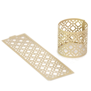 Macro shot of laser-cut gold paper lamp shade with intricate geometric hollow patterns