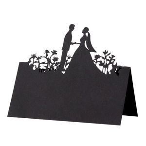 Laser cut black wedding place cards with elegant bride and groom silhouette detail