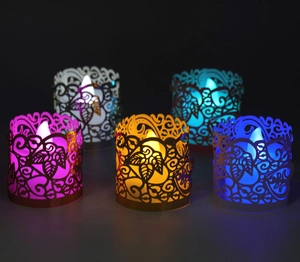 Detail of LED snowflake candle holders with intricate laser-cut hollow patterns in five colors