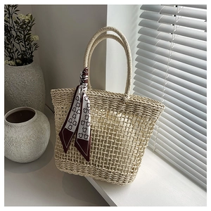 Detailed macro view of cream hollow-knit tote bag with teddy bear silk scarf