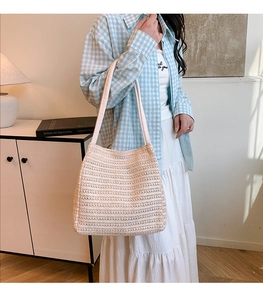 Chic beige woven tote bag for women showing a casual summer shoulder strap style