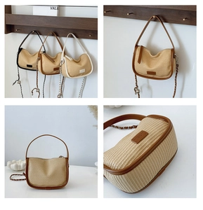 Detailed close-up of woven straw saddle bag featuring leather trim and metal chain strap