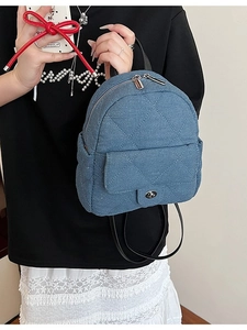 Chic blue quilted denim mini backpack featuring metal turn-lock and adjustable straps