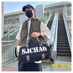 Close-up of black high-density nylon travel bag with SJCHAO brand logo and webbed handles