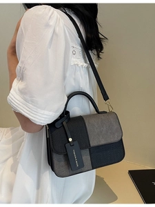 Minimalist vintage patchwork tote bag in black and grey with a top handle and shoulder strap