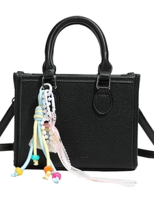 Elegant black lychee leather handbag with colorful Love pendant and detachable strap