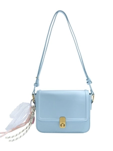 Light blue faux leather crossbody bag with a gold twist lock and colorful rope charms