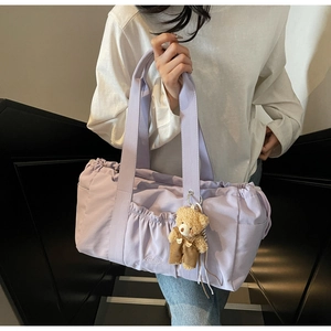 Lilac canvas tote bag with side pockets and cute teddy bear charm accessory
