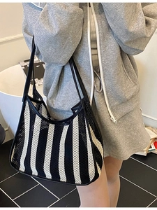 Women's black and white striped mesh tote bag for summer beach travel and daily commute