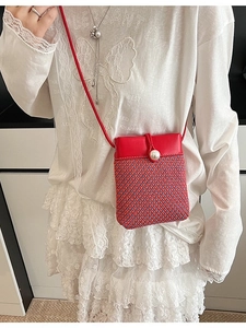 Handwoven crossbody phone bag with red-blue contrast weave and pearl closure detail