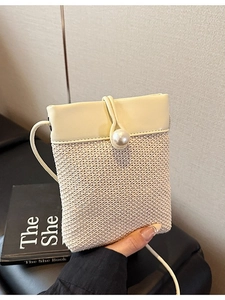 Woven straw crossbody phone bag with cream leather flap and pearl accent for women