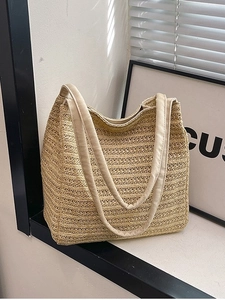 Minimalist straw woven tote bag with large capacity and natural texture for summer beach use