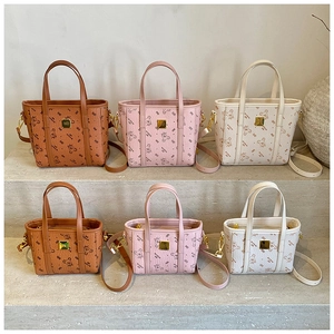 Detail of luxury tote bags in three colors and two sizes with teddy bear print texture