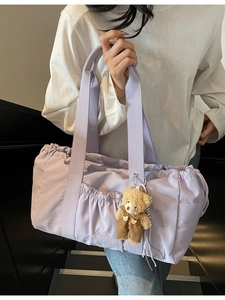 Light purple nylon tote bag with side ruching and cute teddy bear charm for women